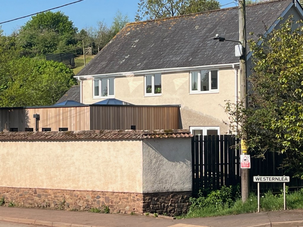 Cedar clad extension from the road
